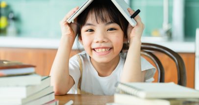 Asian child studying at home